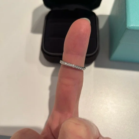 Tiffany & Co. Platinum and diamond half circle band ring. Total .17 ct